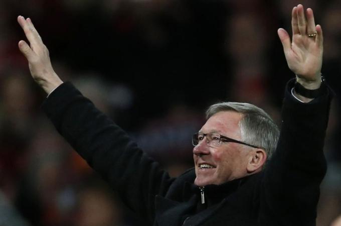 Manchester United''s manager Ferguson celebrates after his team clinched the English Premier League soccer title with a win against Aston Villa at Old Trafford in Manchester