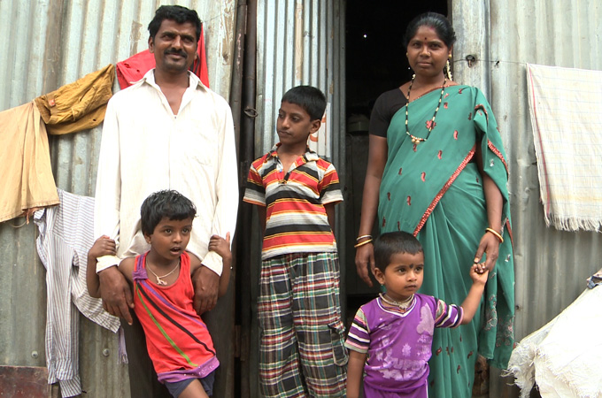 Two years ago, Bhimesh (centre) has a noticeable curve in his back and was looked down upon by his peers [Al Jazeera]