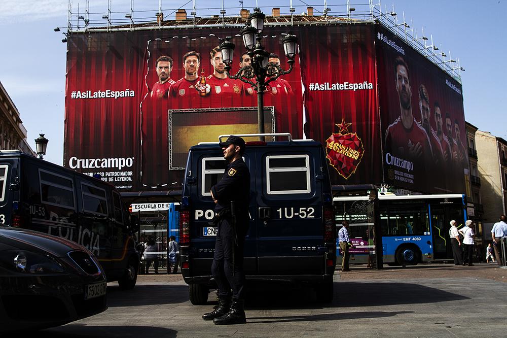 Police stand by in central Madrid on King Felipe VI's coronation day. King Felipe VI was sworn in at a simple ceremony on June 19 at the Congress of Deputies.