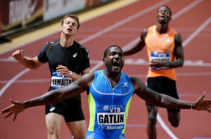 Justin (C) has already run the fastest 100m of the year [REUTERS]