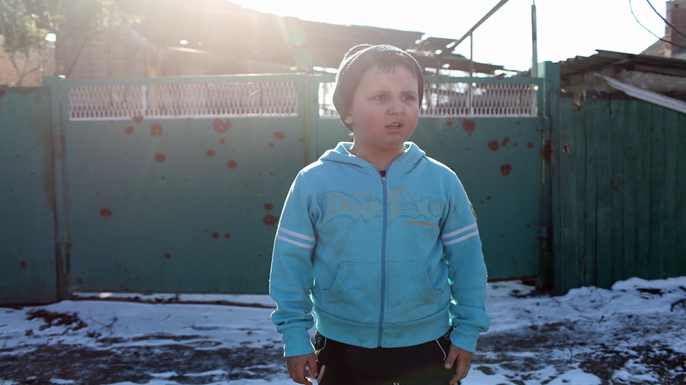 Danil, 9, has lived through combat that has ravaged his neighbourhood [John Wendle] 