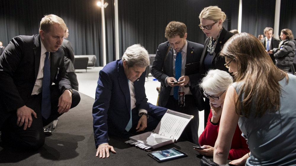 U.S. Secretary of State Kerry and U.S. Under Secretary for Political Affairs Sherman watch a tablet in Lausanne following Iranian nuclear talks