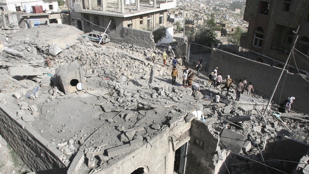 People gather at the site of Saudi-led air strikes in Yemen's central city of Taiz [Reuters]