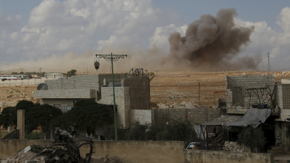 Smoke rises after what activists said were cluster bombs dropped by the Russian air force in Maaret al-Naaman town in Idlib province, Syria