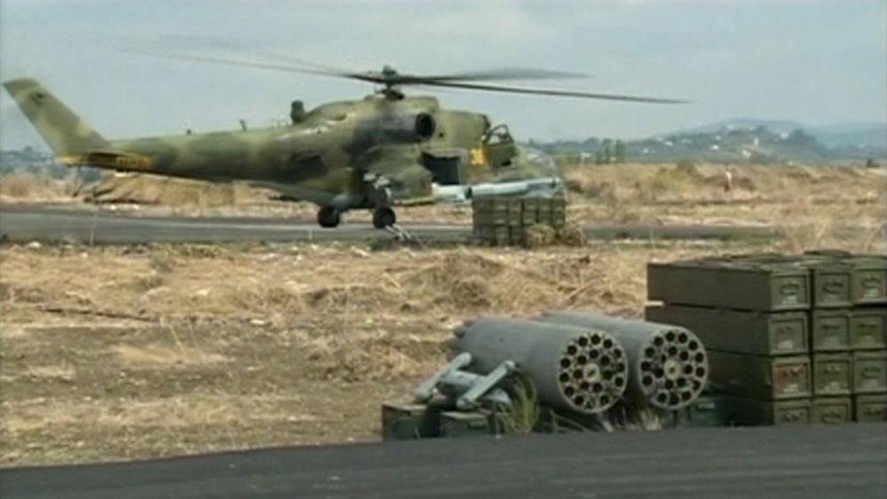 A still image shows a Russian air force helicopter on the tarmac of Heymim air base near the Syrian port town of Latakia
