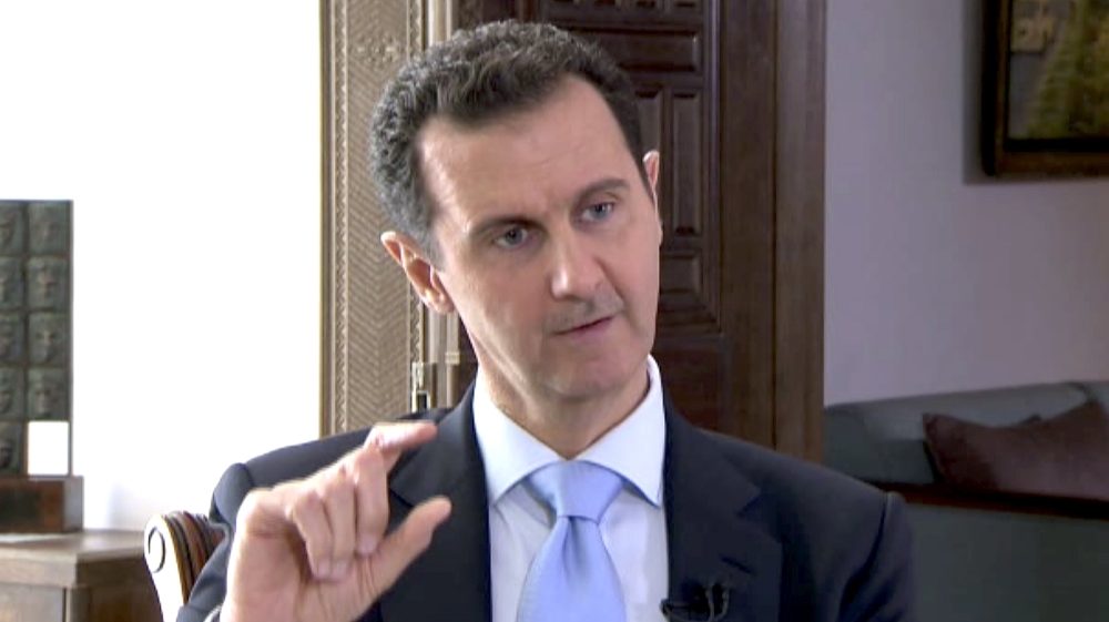 Syrian President Bashar al-Assad speaks during a TV interview in Damascus