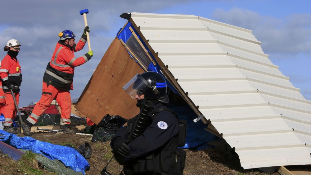
Known as the Jungle, the Calais camp was used by refugees who wanted to migrate to Britain [Pascal Rossignol/Reuters] 