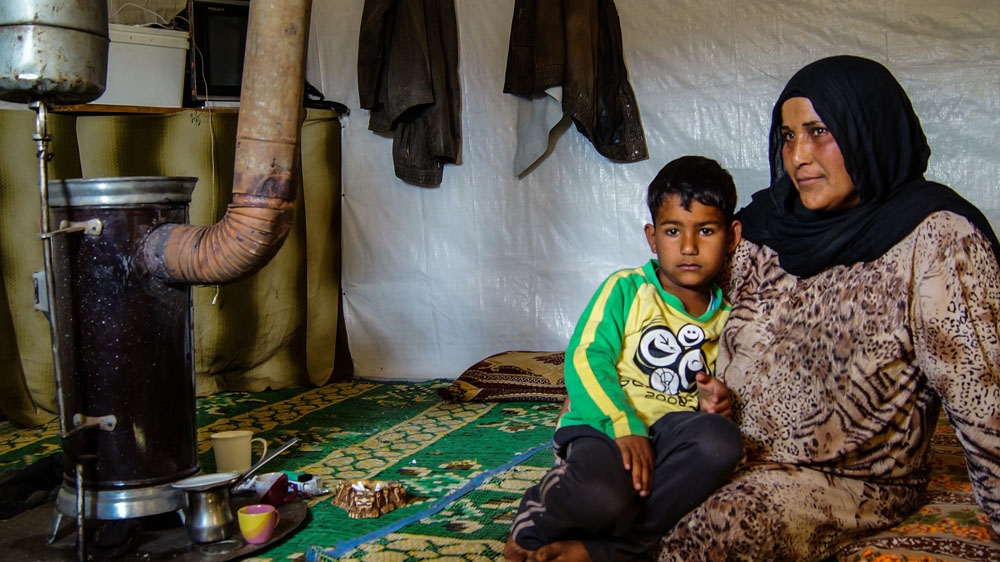 In May 2011, the Syrian army raided Zeinab's hometown. She fled, along with her husband and two children, over the al-Kabir River into Lebanon [Natalia Ojewska/Al Jazeera]