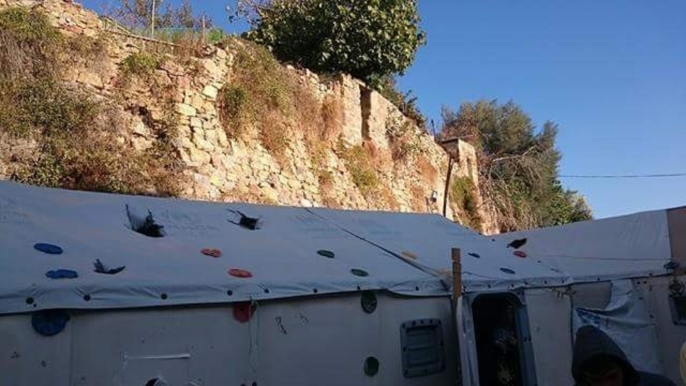 Massive stones were thrown directly into the refugees' tents from the top of the castle's ruins [Carlo Pirrone/A Drop in the Ocean]