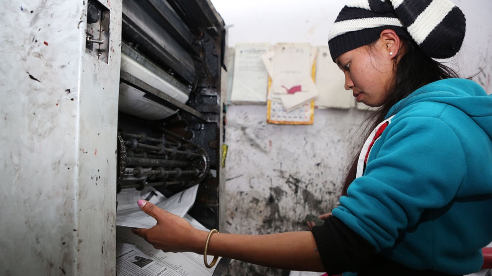 Rolpa Samachar is published at the small printing press in the newspaper's two-room office [Prabhat Jha/Al Jazeera]