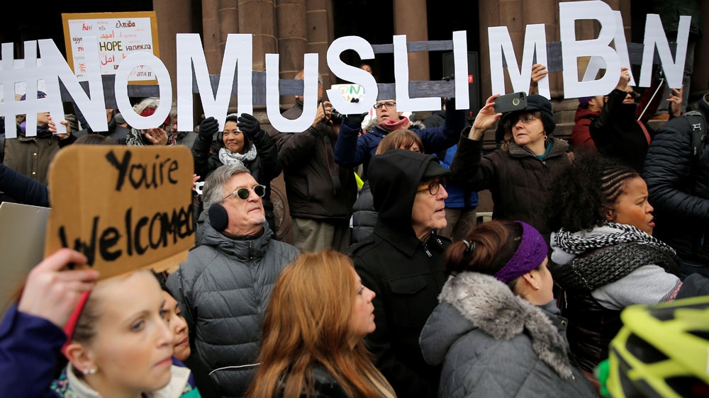 Demonstrators spell out 