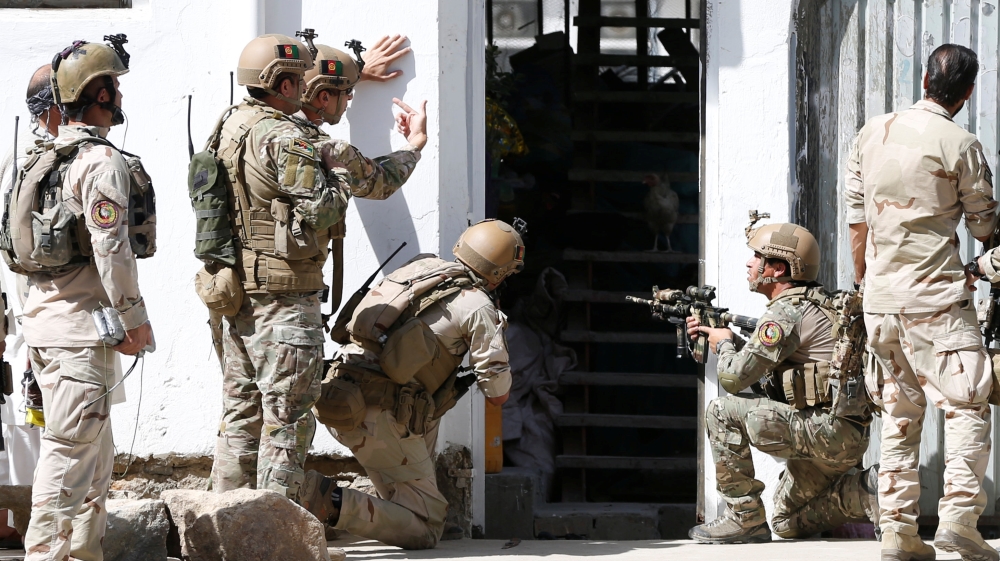 Afghan security forces arrive at the site of the suicide attack [Reuters]