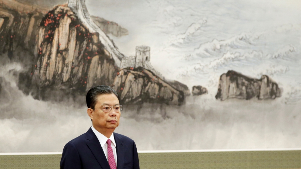 New Politburo Standing Committee member Zhao Leji attends a meeting with media in Beijing