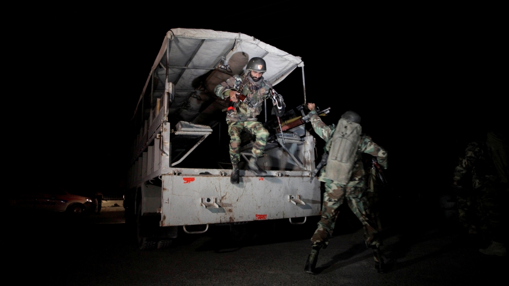 Pakistani troops deploy outside the Police Training Center after an attack on the center in Quetta