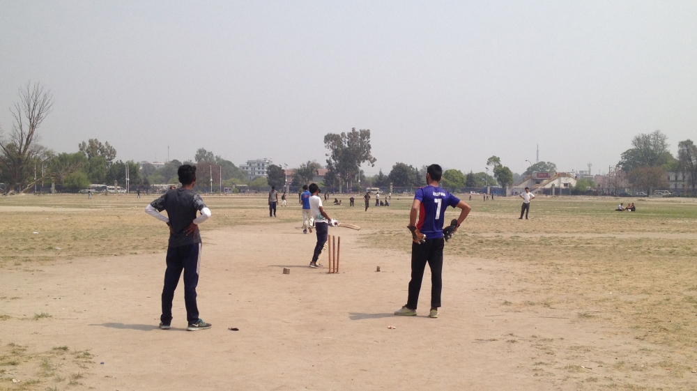 
Tundikhel, Kathmandu's biggest public space, hosts around three cricket matches simultaneously [Roshan Sedhai/Al Jazeera]
