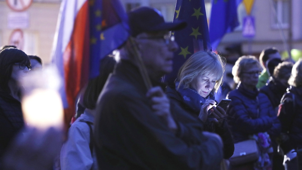 Rallies are expected to continue across the country on Monday, a day before the new law goes into effect [Czarek Sokolowski/The Associated Press]