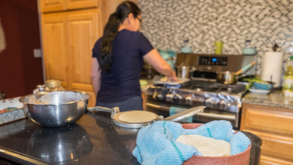 Alfredo and his wife consider themselves lucky to have obtained their green cards before the proposal was announced [Eline van Nes/Al Jazeera] 