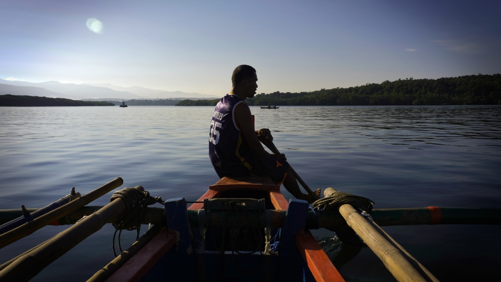 Residents of San Salvador travel to and from the mainland on bangkas, or small wooden outriggers. Larger versions of these vessels called lantsas are used for longer journeys in the open sea [Santiago Arnaiz/Al Jazeera]