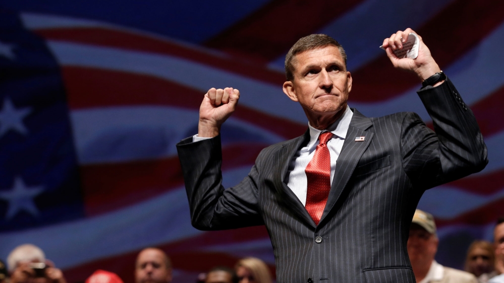 Michael Flynn reacts at a campaign event for then-Republican presidential nominee Donald Trump in Virginia Beach, Virginia [File: Mike Segar/Reuters]