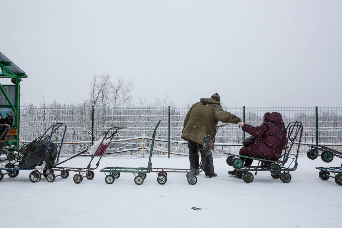 To receive pension and other social benefits, inhabitants living in the non-government-controlled areas have to show up in person in the government-controlled areas every month. The journey is long, e