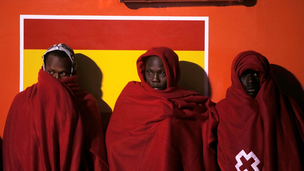 Migrants, intercepted off the coast in the Mediterranean Sea, wait to disembark from a rescue boat after arriving at the port of Malaga, southern Spain, November 29, 2018. Picture taken November 29, 2