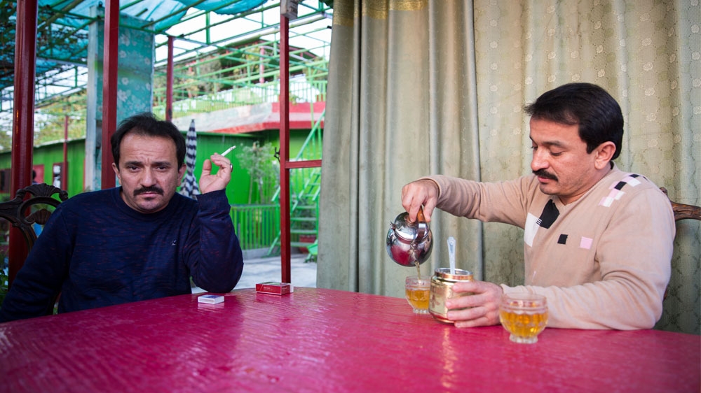 Muhammad Hassan Abdul Hameed, left, says his family members in China are being persecuted [Saiyna Bashir/Al Jazeera]