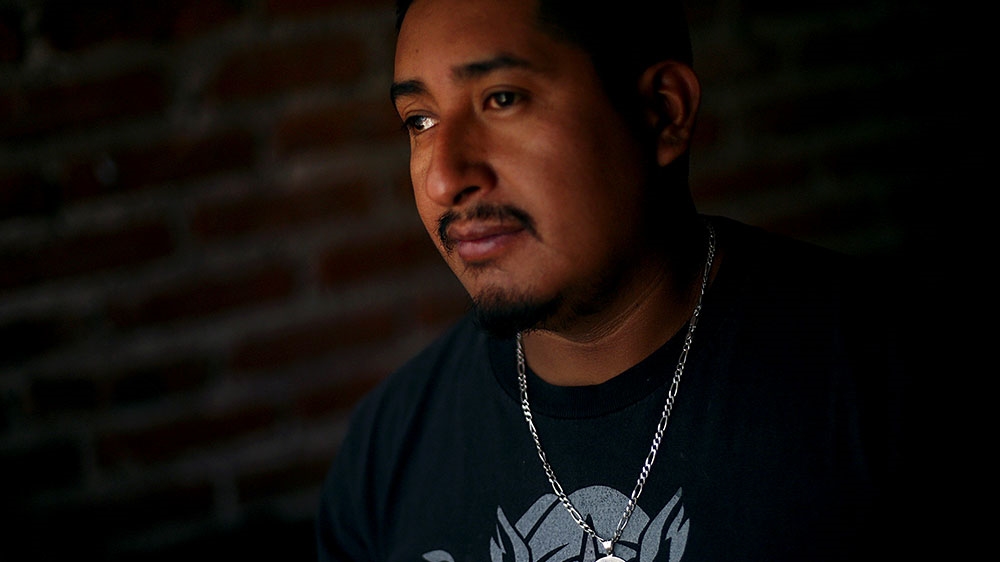 Balbino poses for a photo inside his house in Neutla, Guanajuato state, Mexico [Edgard Garrido/Reuters]