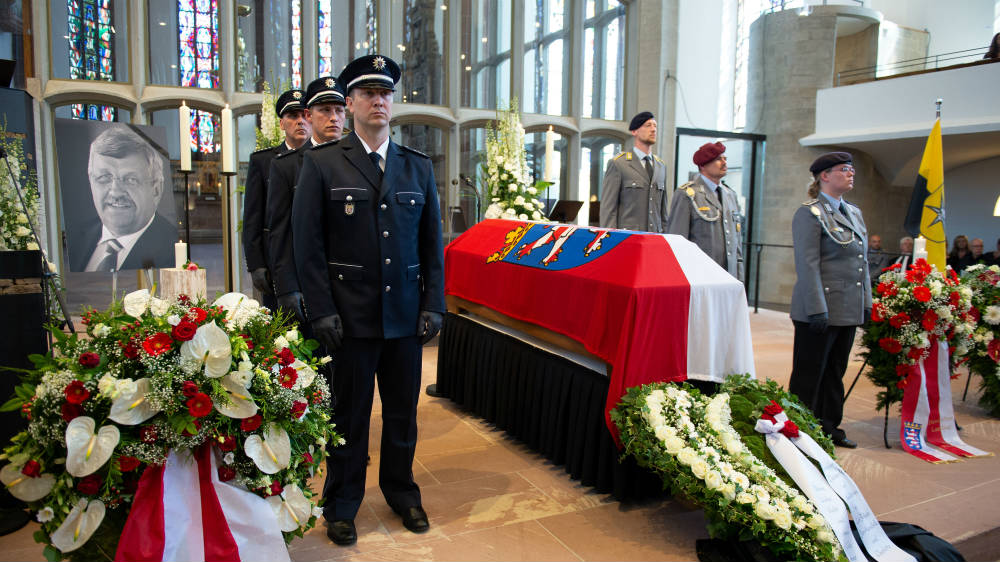 An honour guard made of police and Federal Armed Force officers stands next to the coffin of the Kassel District President, Walter Luebcke, during his funeral at the St Martin Church in Kassel, Germany, on June 13, 2019