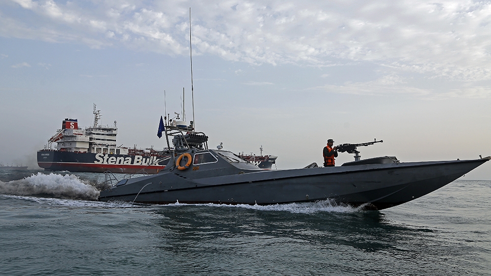 A picture taken on July 21, 2019, shows Iranian Revolutionary Guards patrolling around the British-flagged tanker Stena Impero as it''s anchored off the Iranian port city of Bandar Abbas. - Iran warned