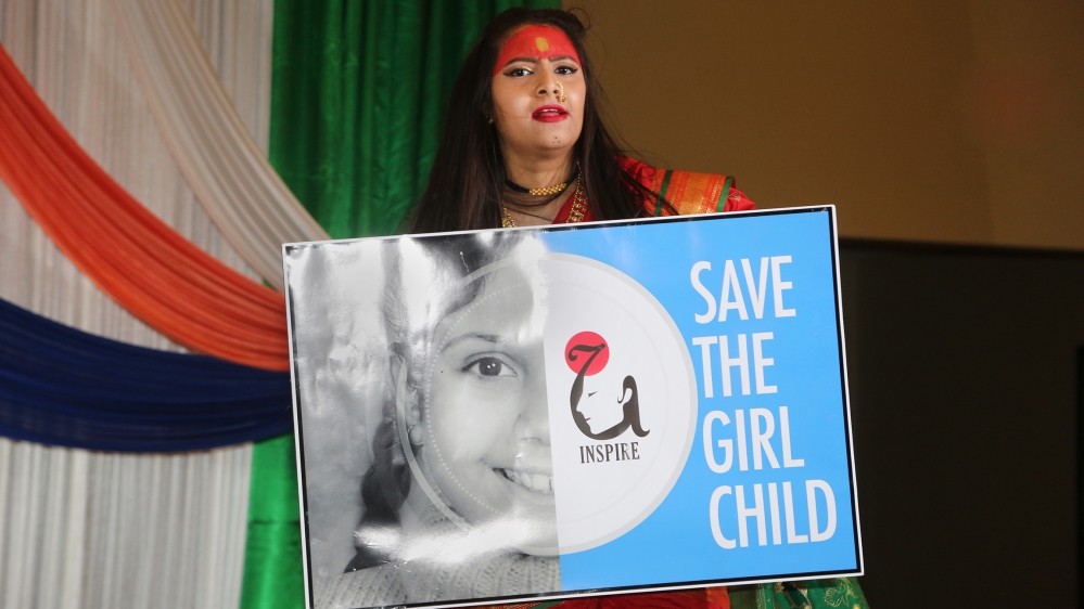 Marathi women perform a folk dance protesting against female infanticide in India and dedicated to the Goddess Durga and the empowerment of women and girls in India. India and China are the leading co