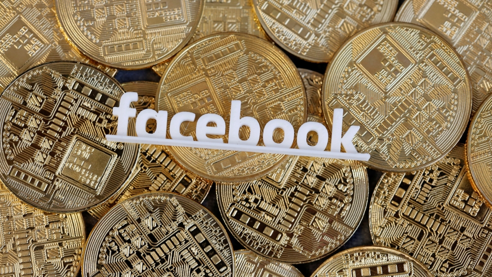 Facebook logo is seen on representations of virtual currency in this illustration picture
