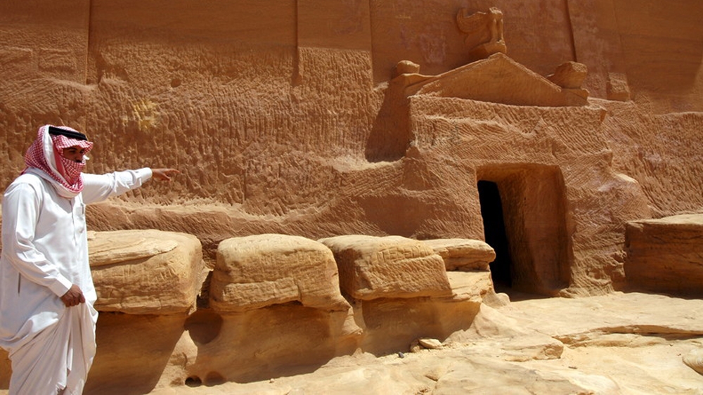 A Saudi man visits a rocky tomb of the ancient city of Madain Saleh, a UNESCO world heritage site, located at al-Ula province in northern Saudi Arabia