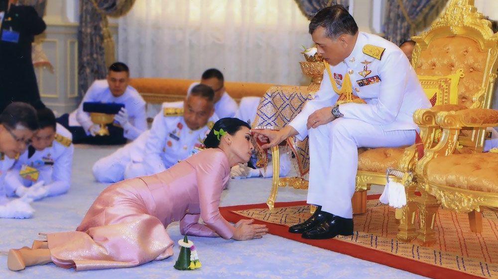 Thailand’s King Maha Vajiralongkorn, right, and Queen Suthida take part in their wedding ceremony in May