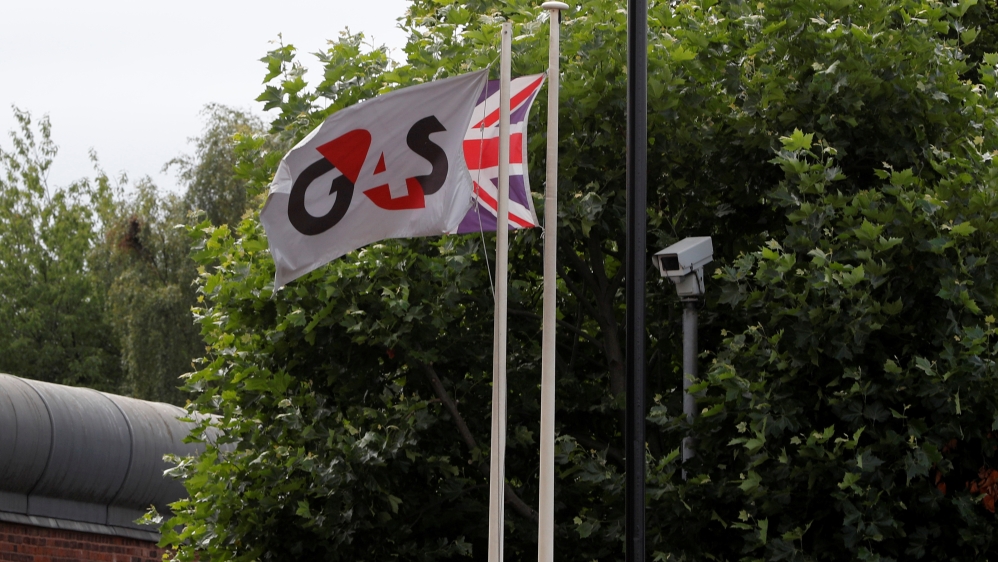 Flags fly outside HMP Birmingham after the British government took over its running from G4S, in Birmingham