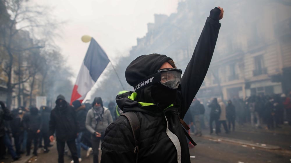 A protester gestures during a demonstration against French government’s pensions reform plans, as part of a day of national strike and protests, in Paris