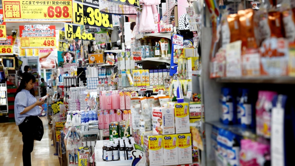 Shoppers browse products at Japanese
