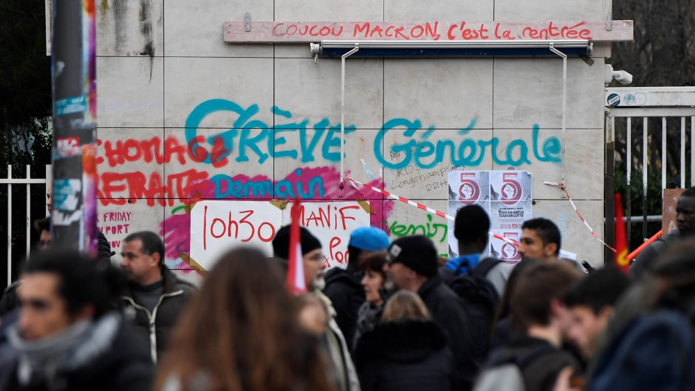 People gather in front of the Saint Charles University ahead of a demonstration to protest against the pension overhauls in Marseille, southern France, on December 5, 2019, as part of a national general strike