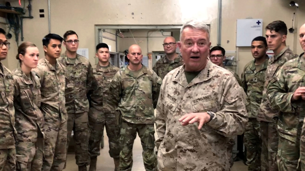 Marine General Kenneth McKenzie, head of US Central Command, speaking with US troops while visiting a base in Jalalabad, Afghanistan,