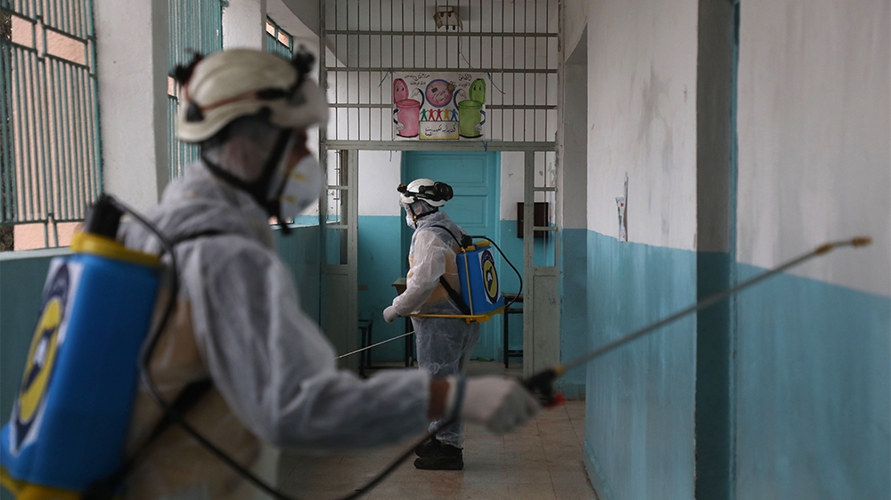 Members of the Syrian Civil Defence, also known as the