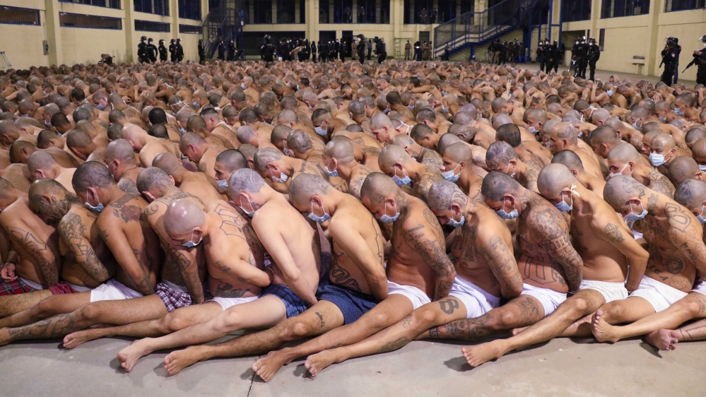 Inmates lined up during a security operation under the watch of police at the Izalco prison in San Salvador, El Salvador