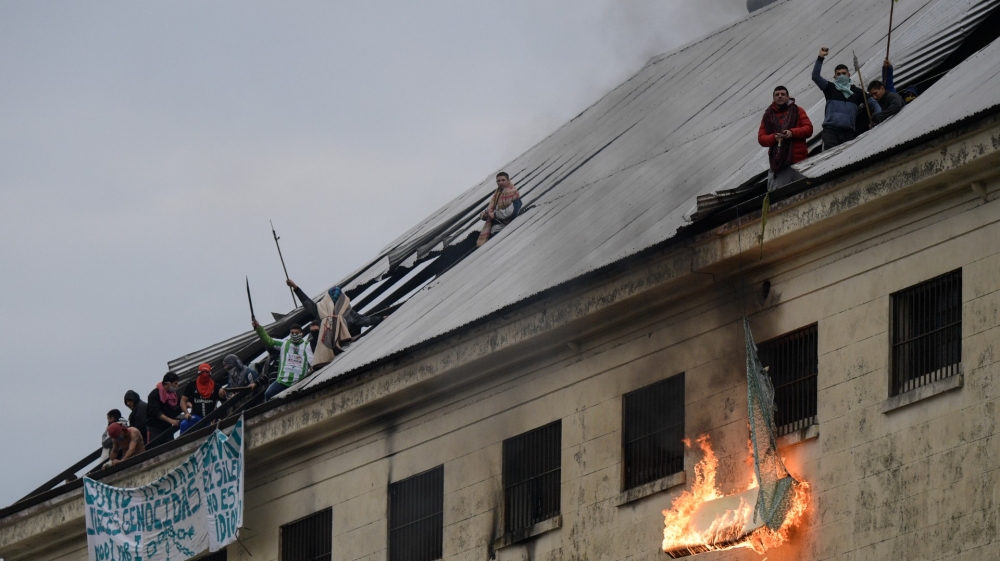 Inmates from Villa Devoto prison burn mattresses during a riot demanding measures to prevent the spread of the coronavirus