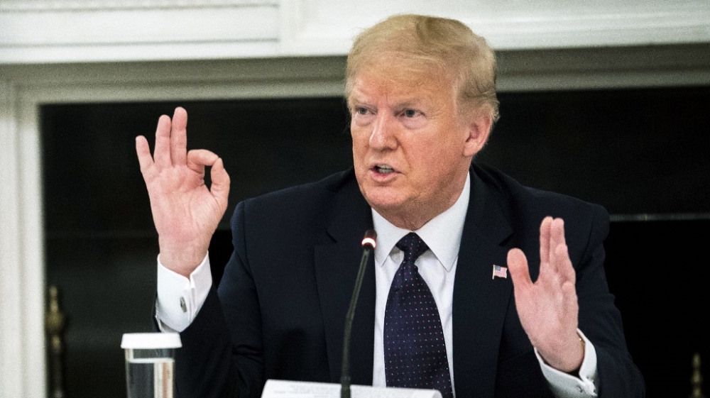 Trump speaks during a roundtable in the State Dining Room of the White House