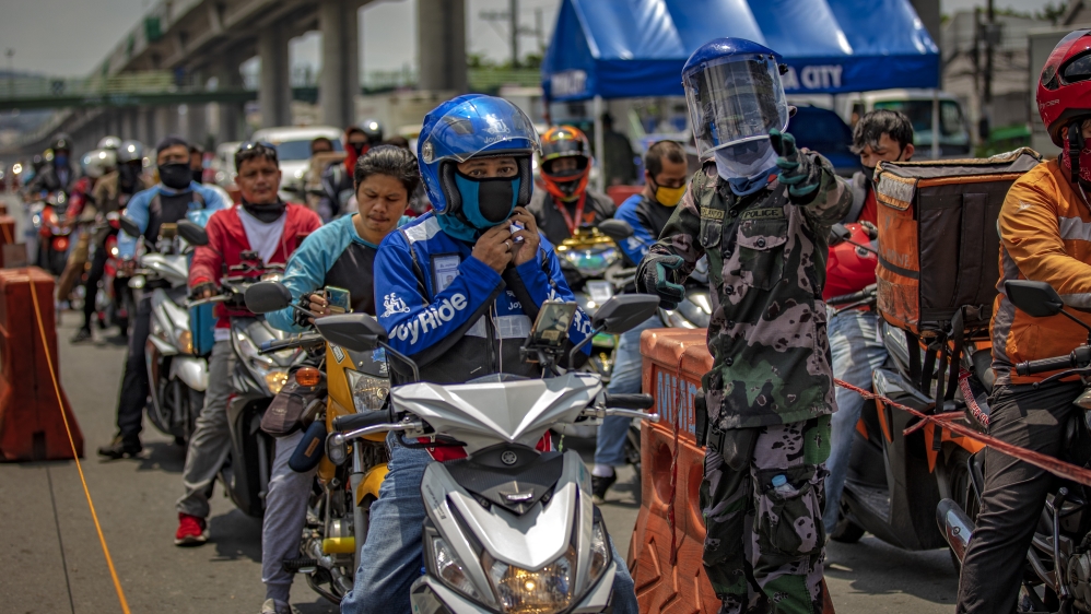 Motorists at a quarantine checkpoint after the government relaxed lockdown measures and allowed more industries to resume in Marikina, Metro Manila, Philippines