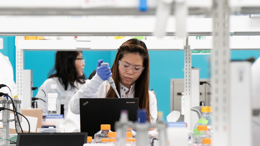 Research associate Phuong-Danh Tran, of RNA medicines company Arcturus Therapeutics, conducts research on a vaccine for the new coronavirus in a laboratory in San Diego, California