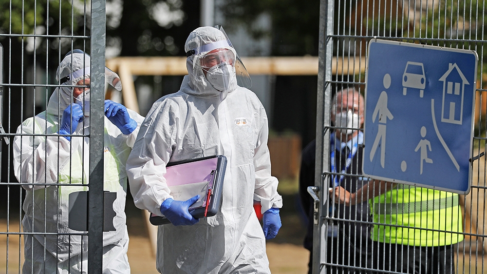Employees of the Public Order Office leave the refugee accommodation in Sankt Augustin, Germany