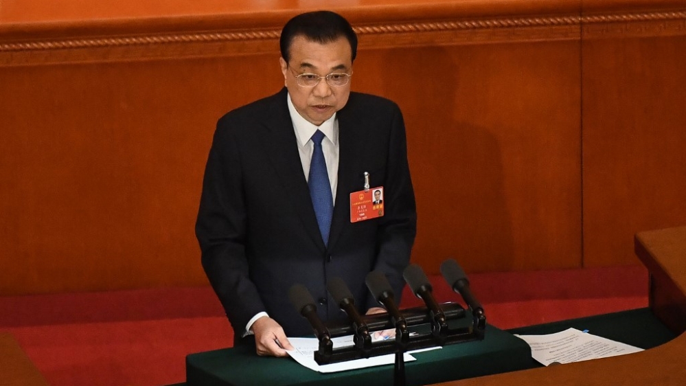 Chinese Premier Li Keqiang delivers his work report during the opening session of the National People’s Congress (NPC) at the Great Hall of the People in Beijing on May 22, 2020