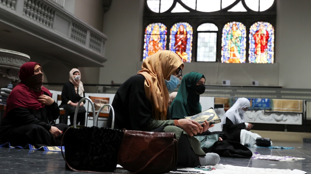 Muslims pray inside the evangelical church of St. Martha’s parish in Berlin, Germany