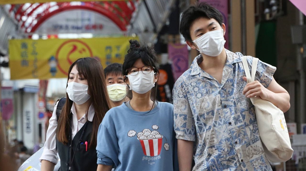 Shoppers in the Japanese city of Yokohama take a stroll in one of the city’s business centres on Tuesday