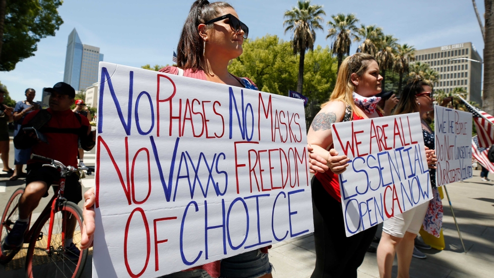 Demonstrators calling for California Governor Gavin Newsom to end the stay-at-home orders during a protest at the Capitol in Sacramento, California