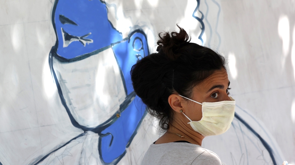 An Emergency room doctor paints a mural outside of Zuni restaurant to honor medical workers during coronavirus COVID-19 pandemic on June 22, 2020 in San Francisco, California. Doctors and medical work